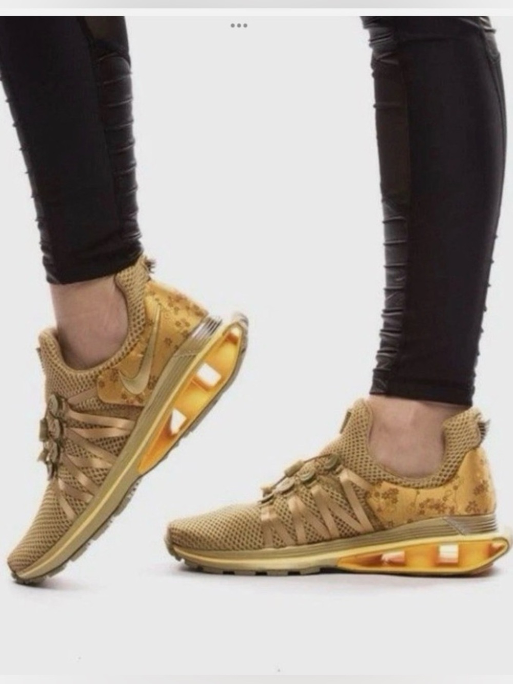 Nike Women's Shox Gravity sneakers in the "Metallic Gold Floral" colorway 8.5